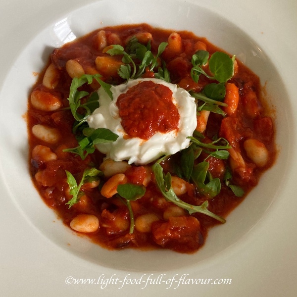 Beans with harissa tomato sauce